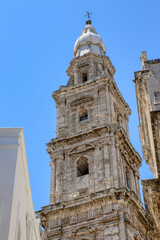 Obraz premium The bell tower of the Basilica of the Madonna della Madia, Monopoli Cathedral in the old town of Monopoli, Puglia, Italy