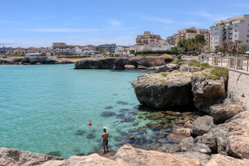 Cala Cozze beach in the old town of Monopoli, Puglia, Italy