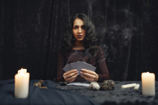 Portrait of fortune-teller in a dark room
