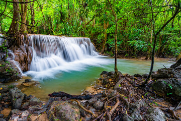 Waterfall and blue emerald water color in Huay Mae Khamin national park. Huay Mae Khamin, Beautiful nature rock waterfall steps in tropical rainforest at Kanchanaburi province, Thailand