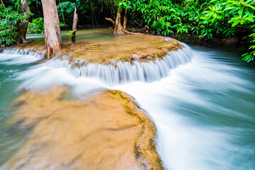 Waterfall and blue emerald water color in Huay Mae Khamin national park. Huay Mae Khamin, Beautiful nature rock waterfall steps in tropical rainforest at Kanchanaburi province, Thailand