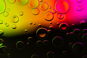 Vivid neon background with bubbles. Colorful abstract backdrop with bright gradients on blobs. Multicolor overflowing picture.
