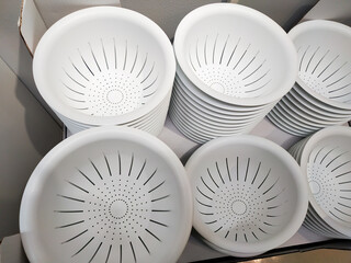 Stack of white plastic container box storage. Plastic containers for home use stack in a store for...