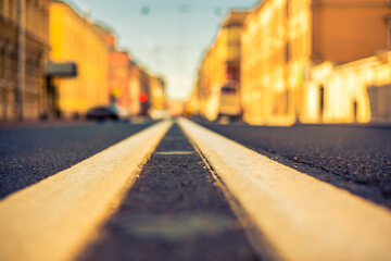 Clear day in the big city, empty city street and stoplight. View of the road at the level of the...