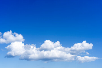 Naklejka na ściany i meble Natural blue sky background with beautiful white clouds
