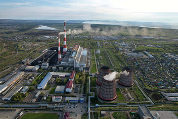 Industrial zone from the air. Thermal power plant. Cooling towers,chimneys, industrial buildings....