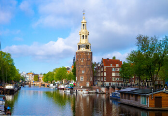 Naklejka premium Montelbaanstoren, a tower on bank of the Oudeschans, Amsterdam canal in the Netherlands