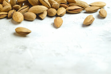 Almonds floating pieces on white background whith a copy space