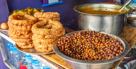 Nepalese food breakfast with Sel Roti and chickpeas. Kathmandu, Nepal.