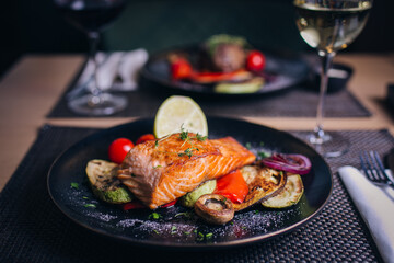 grilled fish with vegetables served on plate
