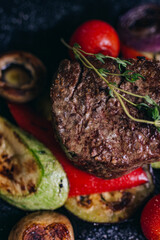 grilled steak with vegetables on plate