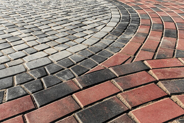 Road surface from a combination of plates of different colors and shapes.