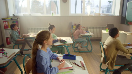 Children learning science in school class. Students having lesson in classroom