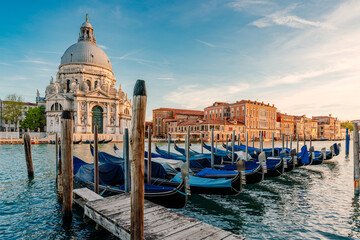 Gondolas and Santa Maria della Salute famous church, Venice, Italy