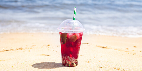ice drink on the beach cold lemonade soda beverage fresh juice, sea coast shore, summer surf wave background refreshing relax positive mood vacation top view