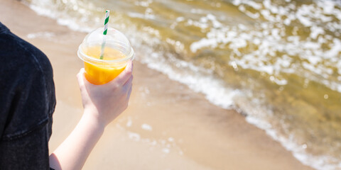 ice drink on the beach cold lemonade soda beverage fresh juice, sea coast shore, summer surf wave background refreshing relax positive mood vacation top view