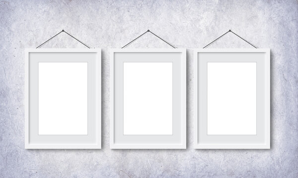 3 Vertical Picture Frame with Grey borders Hanging in Gray Textured Vintage Wall.  Three Empty Blanks.  Professional Design Mock up For Photography, Painting and Wall Art Adverting. 3D illustration.