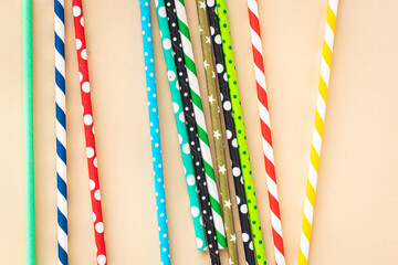 paper cocktail straws multicolored striped dotted straws scattered Flat lay useful ecology biodegradable on the table summer concept party healthy meal copy space food background 