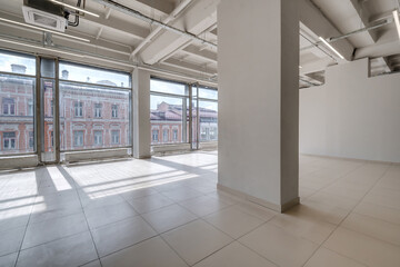 Modern white empty room interior with columns and panoramic windows.  room for office or store