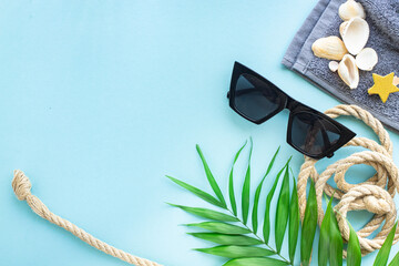 summer background leisure accessories sunglasses palm tropical leaf relax summer vacation positive mood top view