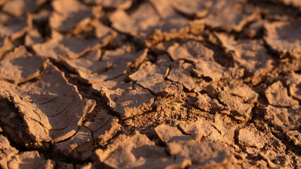 Brown dry cracked background at the top view, effects of global warming