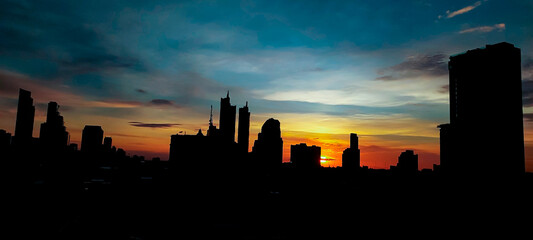 City silhouette sunset sky