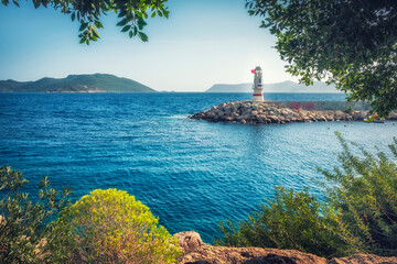 Lighthouse on the sea in the small provincial town of Kas in the province of Antalya, Turkey - obrazy, fototapety, plakaty