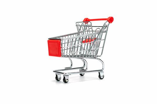 Close-up of Miniature Shopping Cart Against White Background.