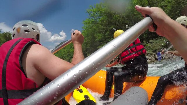 People in boat enjoy on whitewater rafting trip on Tara river in Montenegro
