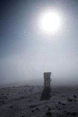 Fototapeta na wymiar gsm pole on a foggy and sunny day in winter