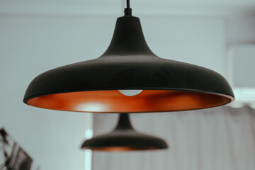 Selective focus shot of a vintage style lamp hanging from the ceiling