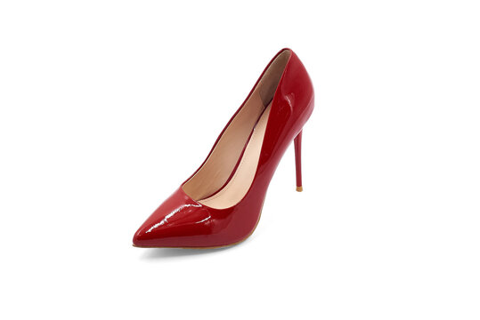 Women's red high-heeled shoes made of glossy leather on a white background. Isolate