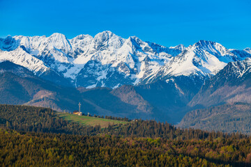 Fototapeta premium View of the snow-capped Tatra Mountains at early morning. View of the ski slope. Jurgów. Poland