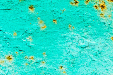 Fototapeta na wymiar Rusty and crumbling green wall