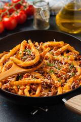 Maccheroni al ferretto with beef in ragu bolognese. Front view.