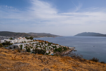 Fototapeta na wymiar Bodrum, Turkey - october 2020: Sunset view from Bodrum coast. Bodrum is one of the most popular summer destinations on Turkey, located by the Aegean Sea, Turkish Riviera.