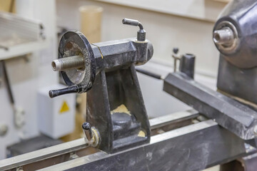 Industrial equipment in a small carpentry workshop. Manual production of wood and precious woods products