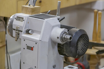 Industrial equipment in a small carpentry workshop. Manual production of wood and precious woods products