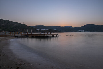 sunset over bay in Aegean sea. Torba, Bodrum, Turkey. October 2020. Long exposure picture