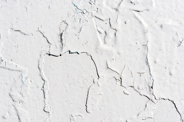 White wall with cracked paint