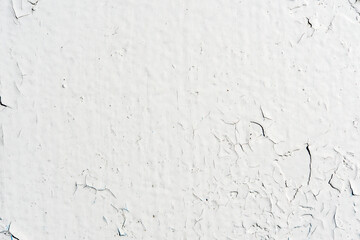 White wall with cracked paint