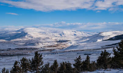 Naklejka na ściany i meble Panoramic view on Erzurum city from mountain skiing resort Palandoken. Turkey, january 2021