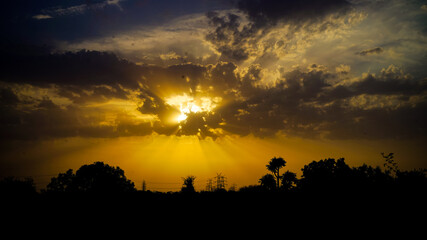 Awesome background of dark clouds before a thunder-storm. Sunny sky and clouds over the horizon