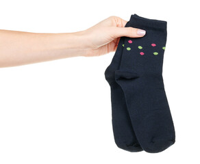 Hand with dark blue cotton socks isolated on white background