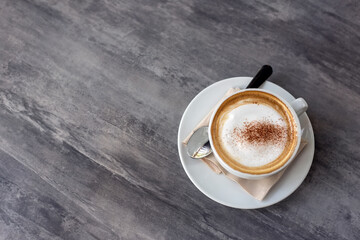 hot coffee cup on marble table in cafe for baverage