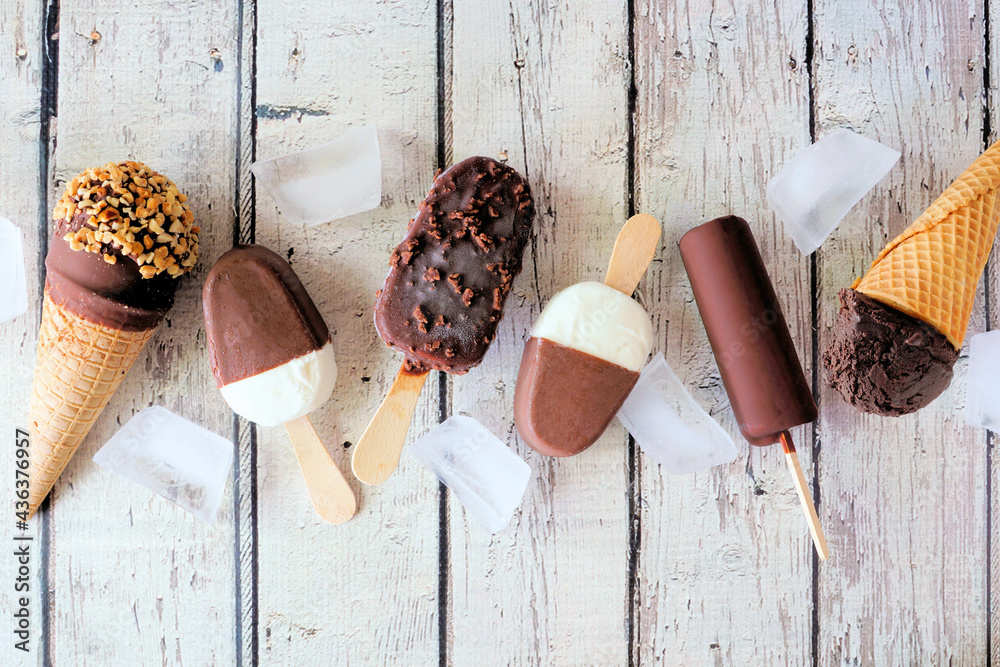 Aufkleber assorted chocolate ice cream desserts. above view scattered on a rustic white wood background.