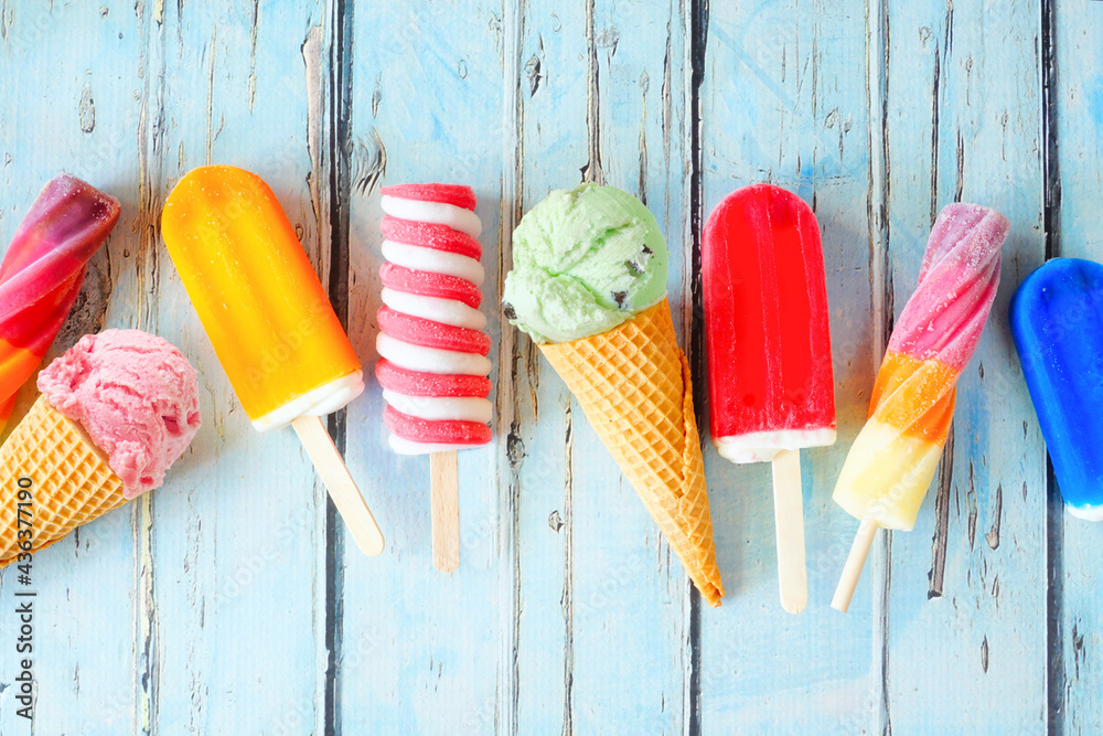 Aufkleber selection of colorful summer popsicles and ice cream treats. overhead view scattered on a rustic blu
