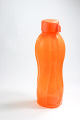 Orange Tupperware water bottle in white background