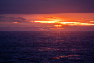 Sunset reflected in the pacific ocean at Yachats on the Oregon coast.