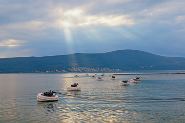 Beautiful Mediterranean landscape at sunset. Mooring buoys. Mooring in the port of Tivat city. Montenegro, Adriatic Sea, Bay of Kotor